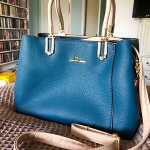 Blue Shoulder Bag with lots of storage and middle zipper.